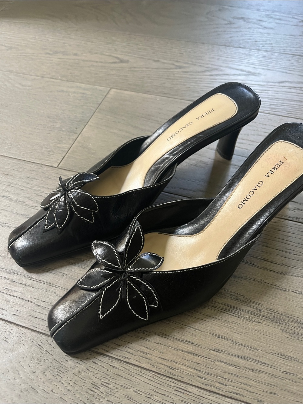 Black Leather Slip-On Heels with Floral Accent